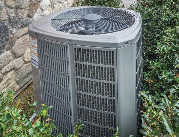 Image of an A/C unit with diverted drip lines.