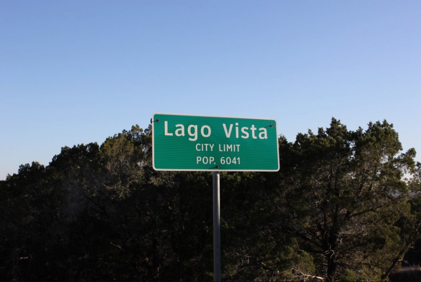Termite Control Service in Lago Vista, Texas City limit sign for Lago Vista, Texas, with a population of 6,041, set against a backdrop of trees